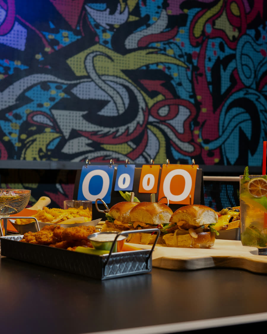 Food and cocktails at a Space Ping Pong table