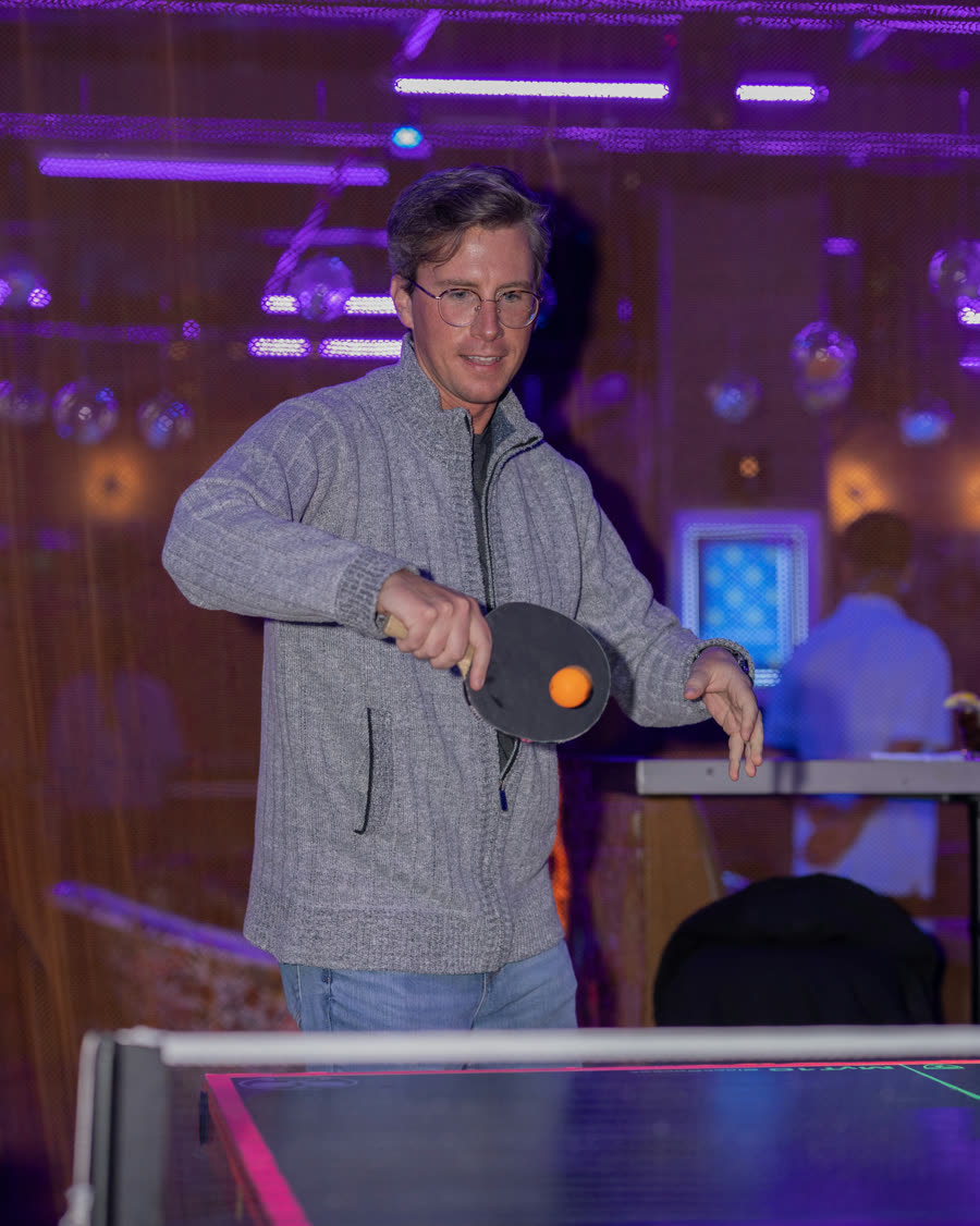 Guest playing ping pong
